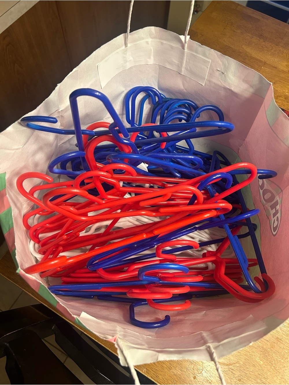 Bundle of White Plastic Clothing Hangers